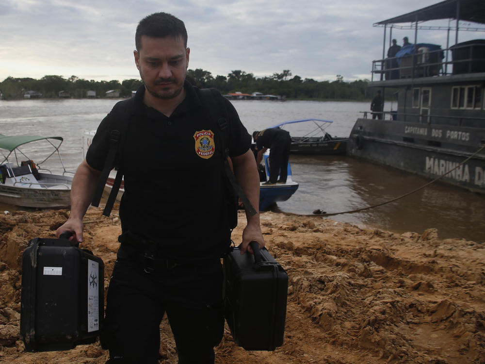 Federal police officers arrive at the pier after searching for Indigenous expert Bruno Pereira and freelance British journalist Dom Phillips in Amazonas state, Brazil, June 14, 2022.