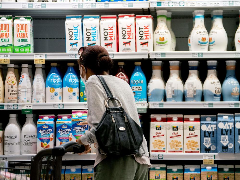 A shopper walks through a grocery store in Washington, D.C., on June 14. Consumer prices are surging at their fastest annual pace in over 40 years.