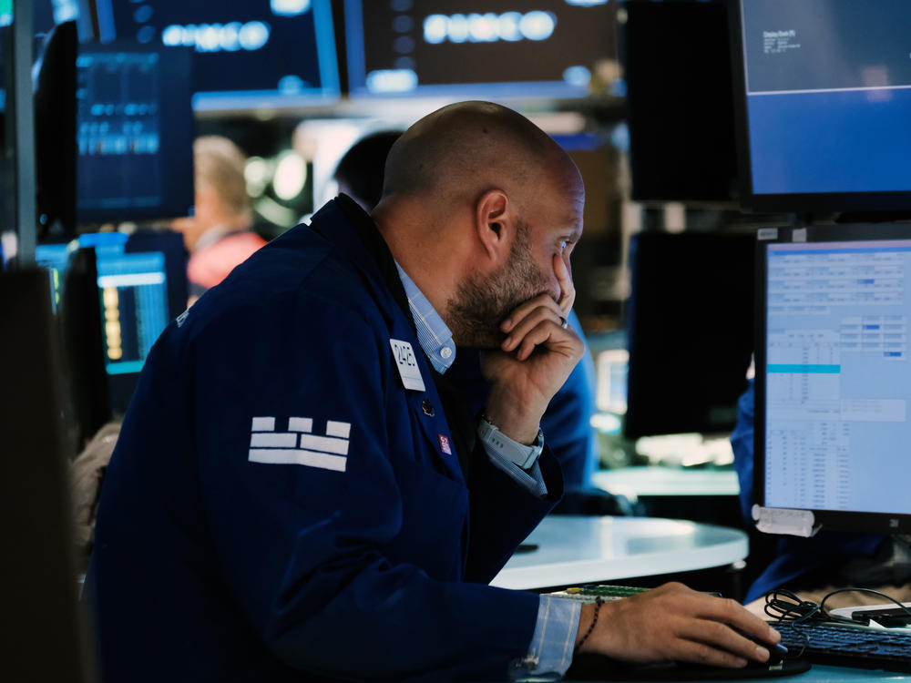 Traders work on the floor of the New York Stock Exchange in New York City on Tuesday. Stocks have slumped as the Fed continues to raise interest rates aggressively to fight red-hot inflation.