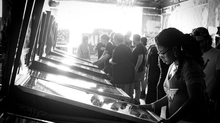 Juana Summers competing in a pinball tournament.