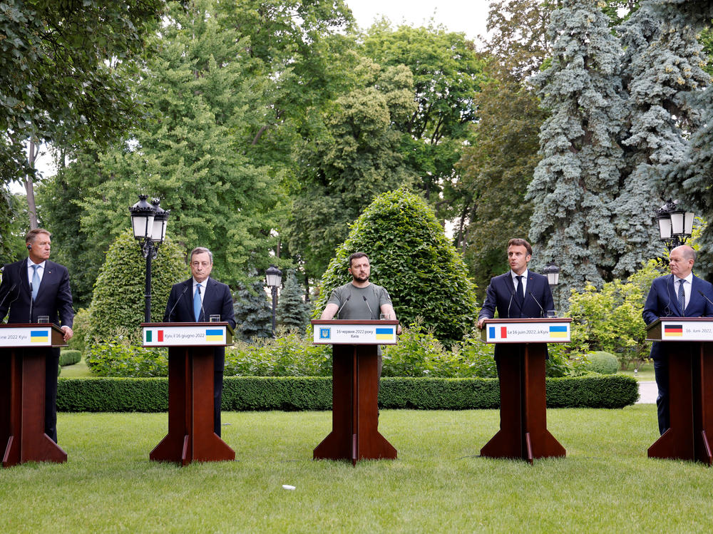 From left, Romanian President Klaus Iohannis, Prime Minister of Italy Mario Draghi, Ukrainian President Volodymyr Zelenskyy, France's President Emmanuel Macron and German Chancellor Olaf Scholz attend a press conference in Kyiv on Thursday. The French, German, Italian and Romanian leaders vowed to back Kyiv's bid to become an official candidate to join the European Union.