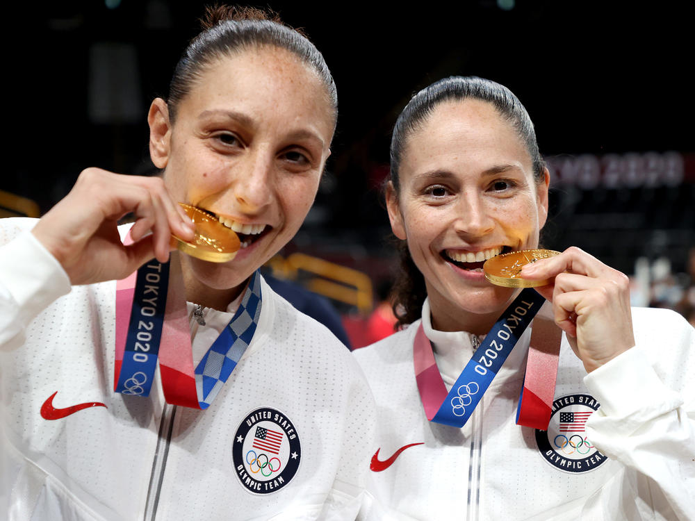 Diana Taurasi (left) and Sue Bird of the U.S. women's basketball team pose with their gold medals during the Tokyo Olympic Games in 2021. The two are tied for the most gold medals in Olympic basketball, for both the women's and men's competitions.