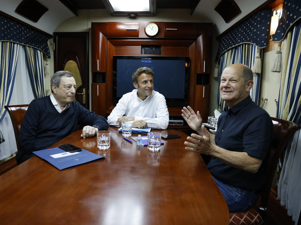 French President Emmanuel Macron (center), German Chancellor Olaf Scholz (right), and Italian Prime Minister Mario Draghi travel on board a train bound to Kyiv after departing from Poland. The three leaders are meeting with Ukraine's President Volodymyr Zelenskyy on Thursday to talk about the war in Ukraine.