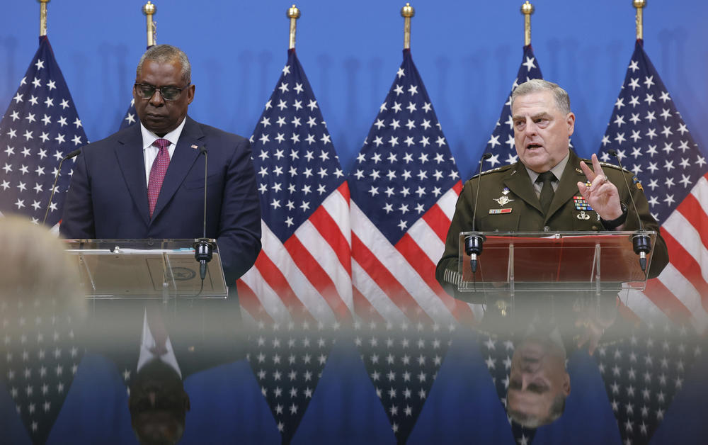 U.S. Defense Secretary Lloyd Austin (left), and U.S. Chairman of the Joint Chiefs of Staff, General Mark Milley speak at NATO headquarters in Brussels on Wednesday. The NATO defense ministers are meeting to discuss the war in Ukraine. The U.S. announced an additional $1 billion in military aid to Ukraine, which includes heavy weapons.