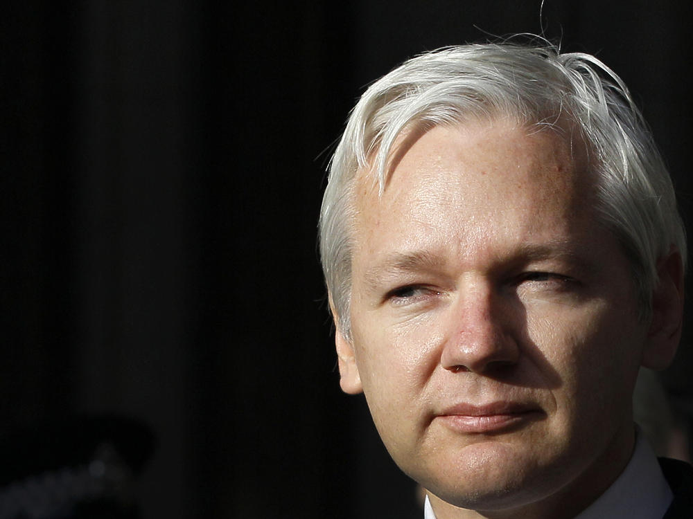 WikiLeaks founder Julian Assange pauses as he makes a statement to media gathered outside the High Court in London in 2011.