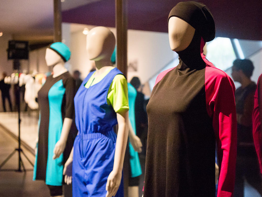 A burkini (right) and a culotte swimmer (center) are on display in the Cherchez la Femme (Look for the Woman) exhibition in the Jewish Museum in Berlin, Germany, on March 30, 2017.