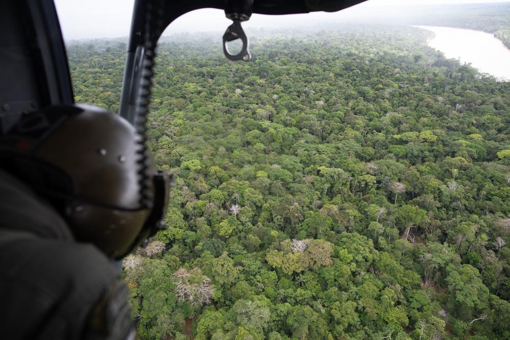 In this aerial view, a Brazilian helicopter patrols an area of the municipality of Atalaia do Norte,  Brazil, in the direction of the Itaquaí River, in the search for missing men Bruno Pereira and Dom Phillips, on June 10.
