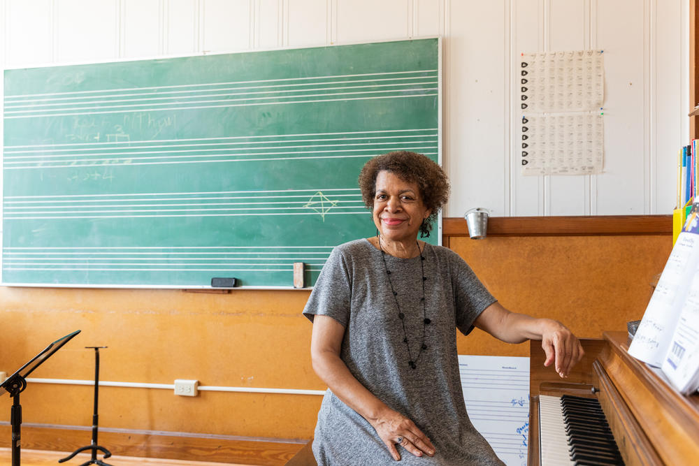 June Collins Pulliam poses for a portrait in a classroom at Fanfare Lutheran Music Academy.