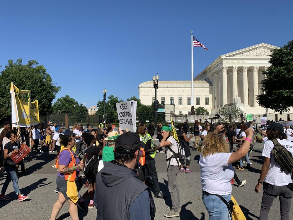 Abortion rights supporters march to the Supreme Court as part of a rally pegged to the Juneteenth holiday weekend.