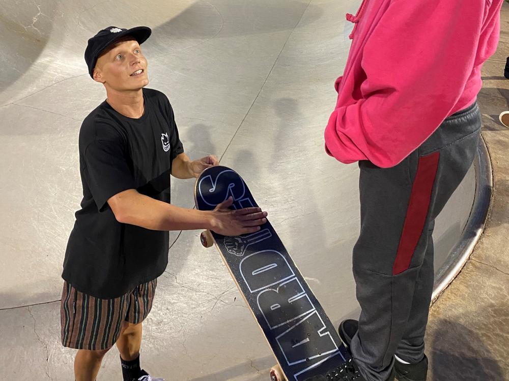Zach Miller (left) is a professional skateboarder from Encinitas, Calif. He gave Seth several skateboards after hearing he didn't have one of his own. In this photo, he's helping a young skater at the Lahaina skatepark in Maui.