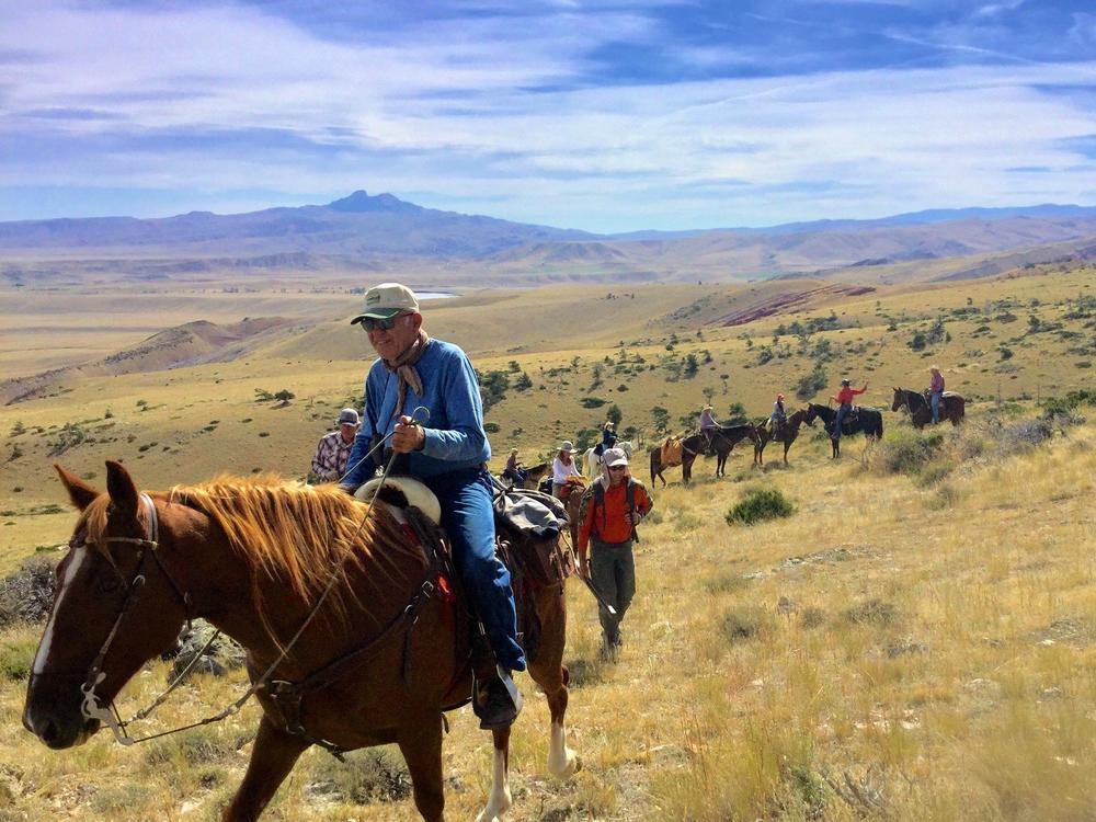 A group on horseback make their way to Bald Ridge in the Shoshone National Forest outside of Cody, Wyo. The national forest spans 2.4 million acres to the east of Yellowstone National Park.