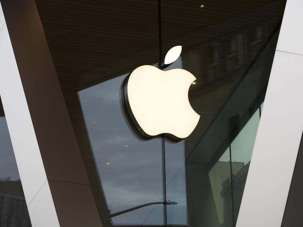 FILE - The Apple logo adorns the facade of a retail store. More than 100 employees of an Apple store in a suburb of Baltimore voted to unionize by a nearly 2-to-1 margin Saturday, June 18, 2022.