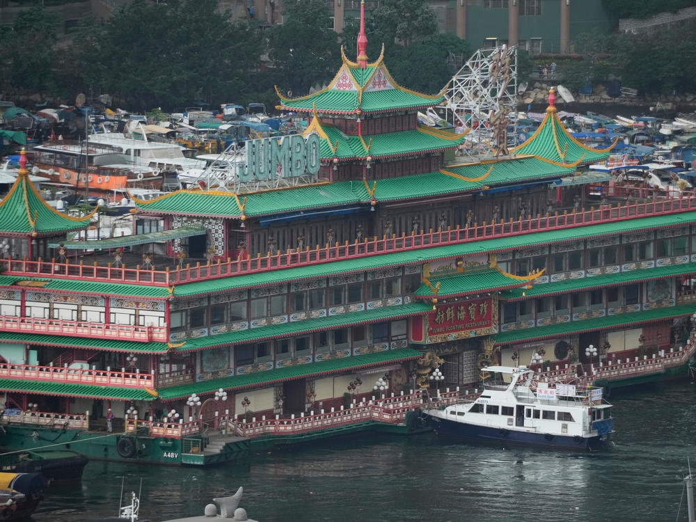 Hong Kong's iconic Jumbo Floating Restaurant is towed away in Hong Kong on June 14. It capsized at sea less than a week later.