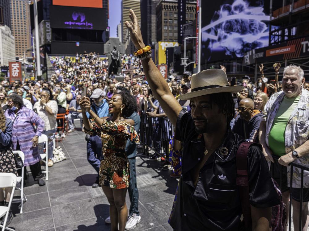 Onlookers react to a performance during a Juneteenth celebration in Times Square, in the Manhattan borough of New York, on Sunday.