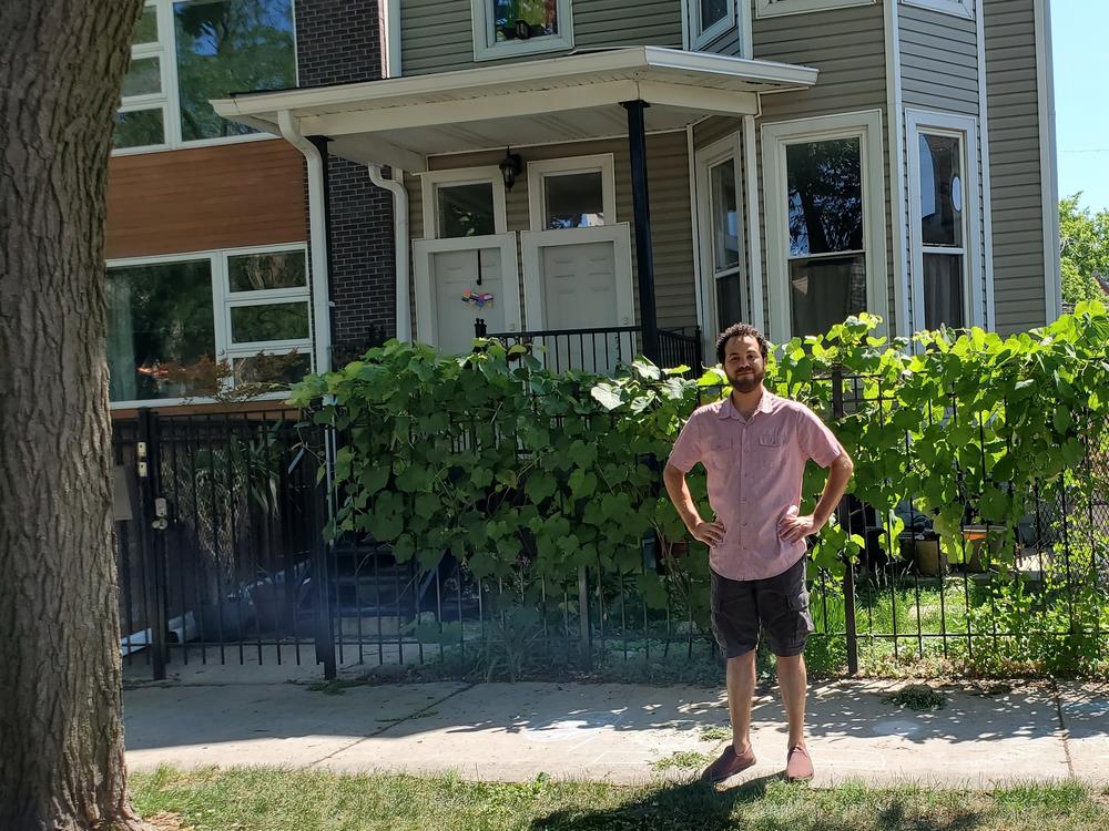 Bashir Nuruddin in front of one of the buildings he owns and rents out in Chicago. When an apartment came open recently, he says, 