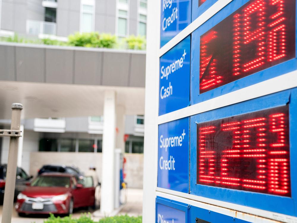 Gas prices are displayed on a sign in Washington on June 14. Consumers are angry gas prices are so high and polls show they blame President Biden for it.