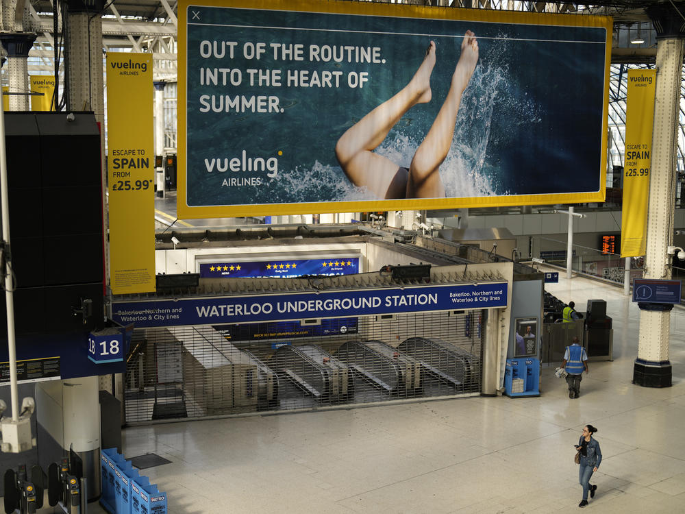 An entrance to Waterloo underground station stands shuttered closed for strike action in Waterloo railway station, in London, Tuesday, June 21, 2022.