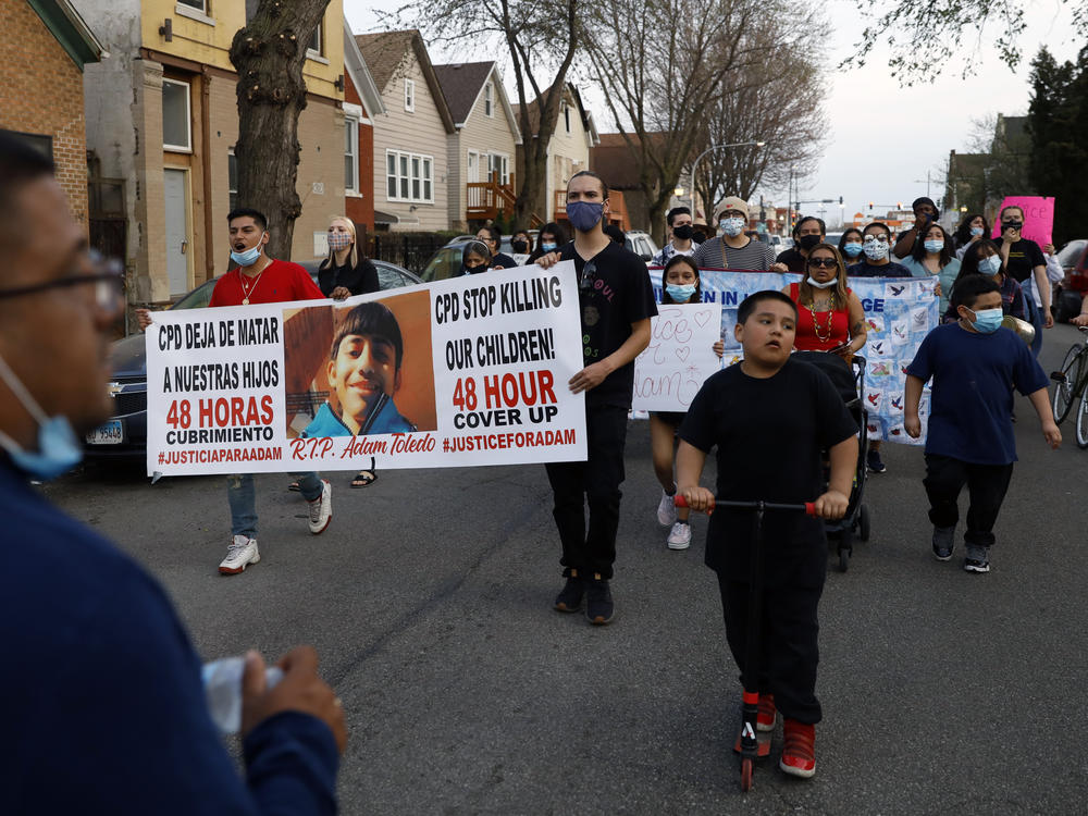 In this April 6, 2021, file photo, members of Chicago's Little Village Community Council protest the death of 13-year-old Adam Toledo.
