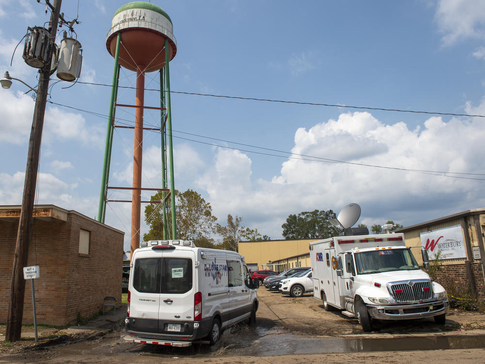 Emergency personnel arrive to evacuate people at a mass shelter, on Sept. 2, 2021 in Independence, La. The owner of seven Louisiana nursing homes whose residents suffered in squalid conditions after being evacuated to a warehouse for Hurricane Ida has been arrested.