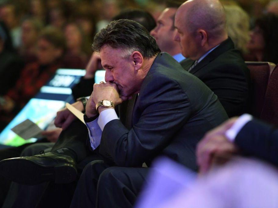 Columbine Principal Frank DeAngelis listens to his students, survivors of the shooting, in April 2019 as he attends 