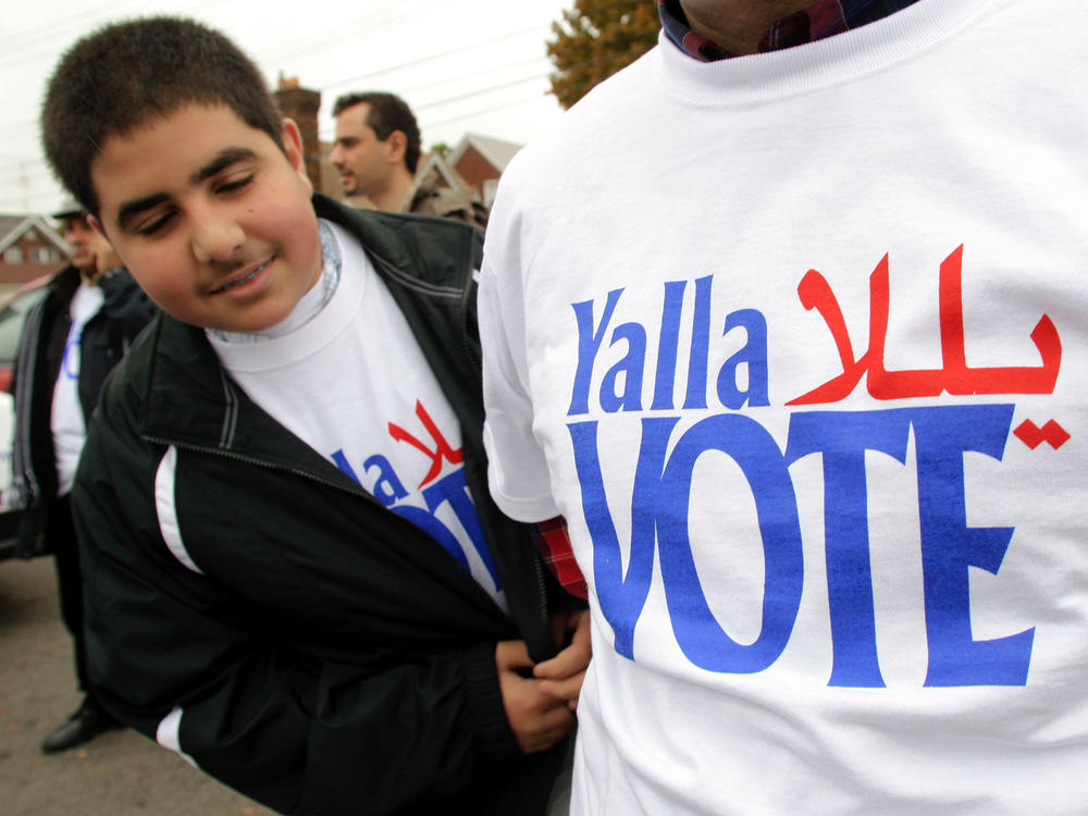 Volunteers take part in a 2004 voter outreach event in Dearborn, Mich., organized by the Arab American Institute. While there is no federal requirement for Arabic-language ballots, the city of Dearborn recently started requiring election materials to be translated into Arabic.