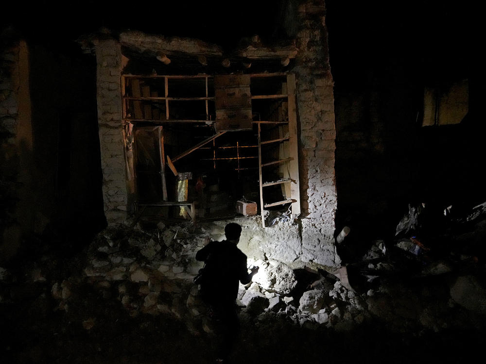 Afghans look for survivors in the village of Gyan, in Paktika province, Afghanistan, Wednesday, June 22, 2022.