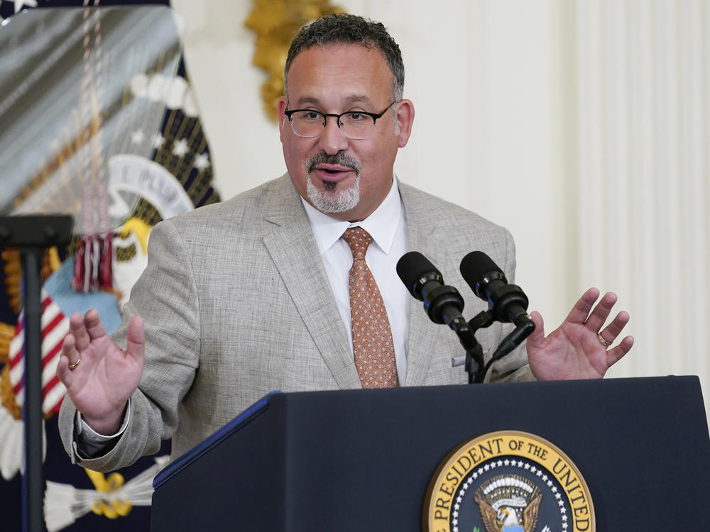 Education Secretary Miguel Cardona speaks at the White House on April 27. The Biden administration proposed a dramatic rewrite of campus sexual assault rules on Thursday, moving to expand protections for LGBTQ students, bolster the rights of victims and widen colleges' responsibilities in addressing sexual misconduct.