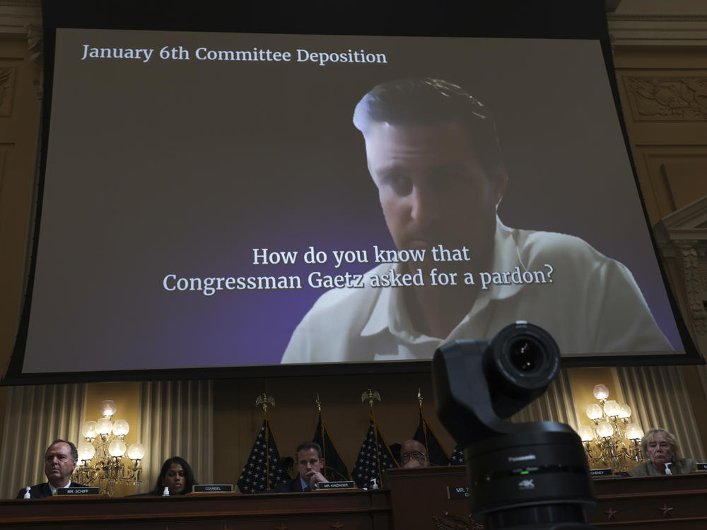 A video displays a discussion about presidential pardons on Thursday during the fifth hearing by the House Select Committee to Investigate the January 6th Attack on the U.S. Capitol.