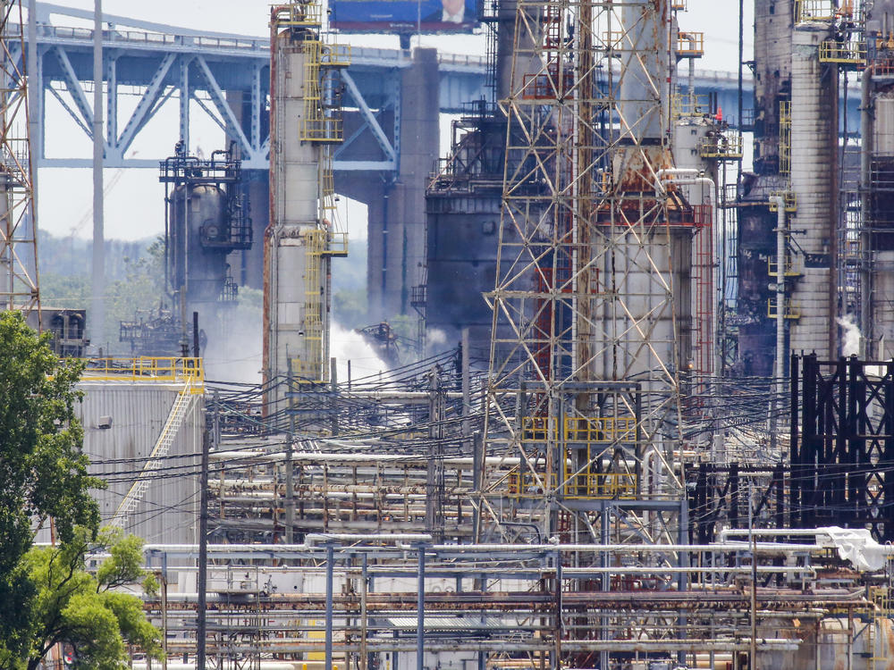 Fire smolders at an oil refinery that triggered several large explosions at the Philadelphia Energy Solutions Refining Complex on June 21, 2019. Fire broke out in the early morning that triggered a vat of butane to ignite with an explosion so large that it was detected from space.