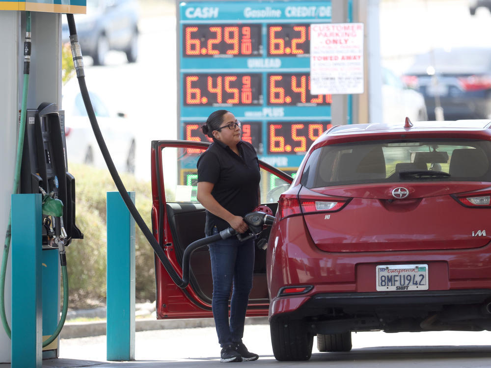PETALUMA, CALIFORNIA - MAY 18: A customer pumps gas into their car at a gas station on May 18, 2022 in Petaluma, California. (Photo by Justin Sullivan/Getty Images)