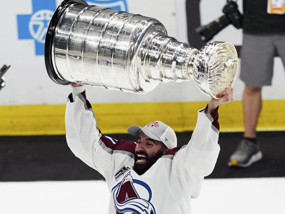 Colorado Avalanche center Nazem Kadri lifts the Stanley Cup after the team defeated the Tampa Bay Lightning 2-1 in Game 6 of the NHL hockey Stanley Cup Finals on Sunday, June 26, 2022, in Tampa, Fla.