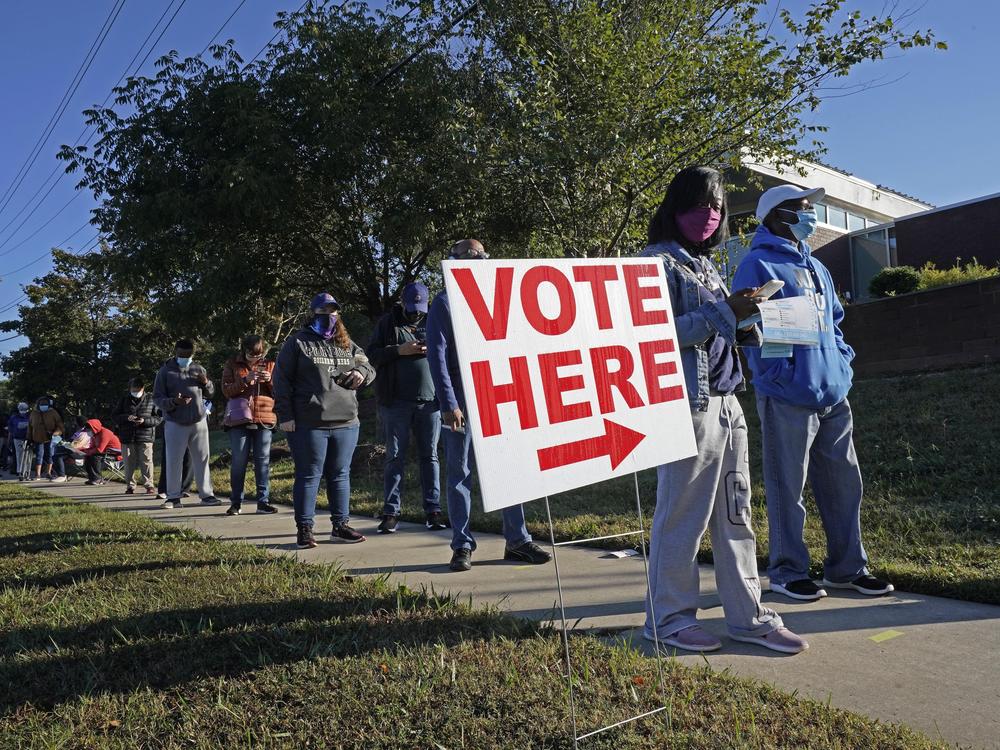 Voters line up to cast their ballots in the 2020 presidential election in Durham, N.C. The U.S. Supreme Court has agreed to hear a North Carolina redistricting case this fall about how much power state legislatures have over how federal elections are run.