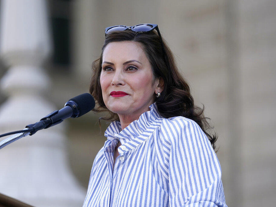 Gov. Gretchen Whitmer speaks to abortion-rights protesters Friday at a rally outside the state capitol in Lansing, Mich., following the Supreme Court's decision to overturn <em>Roe v. Wade.</em>