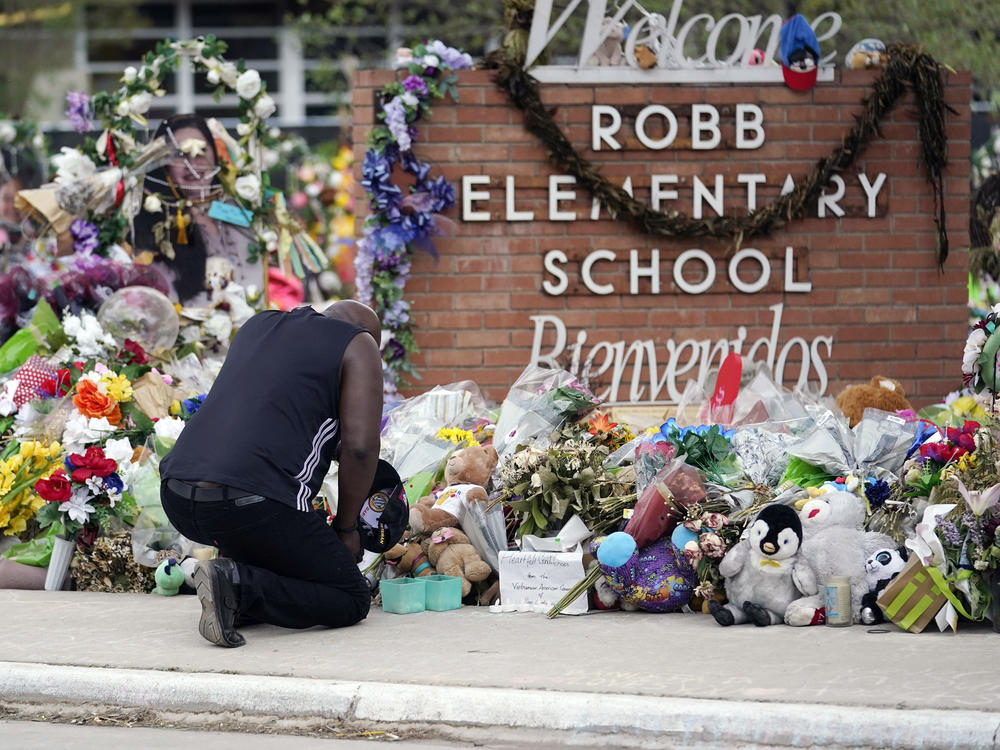 Reggie Daniels pays his respects at a memorial at Robb Elementary School in Uvalde, Texas, on June 9, 2022, honoring the two teachers and 19 students killed in the shooting at the school on May 24.