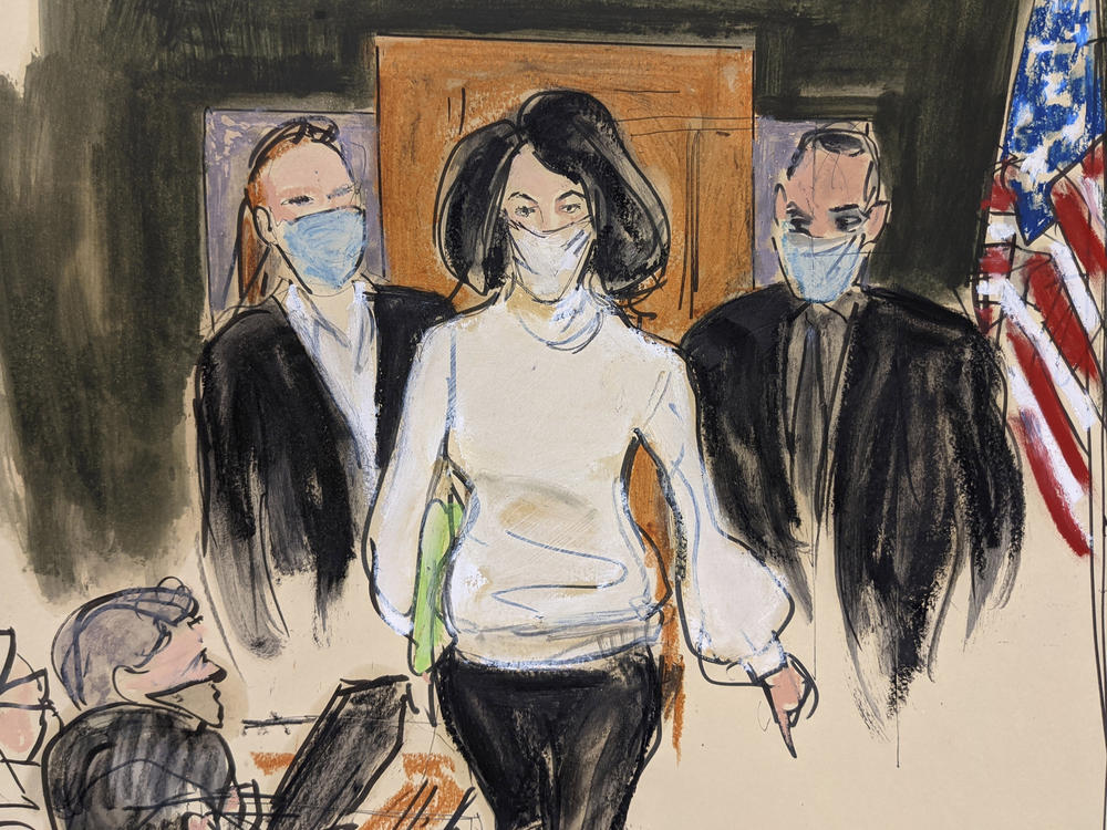In this courtroom sketch, Ghislaine Maxwell enters the courtroom escorted by U.S. Marshalls at the start of her trial, Nov. 29, 2021, in New York.
