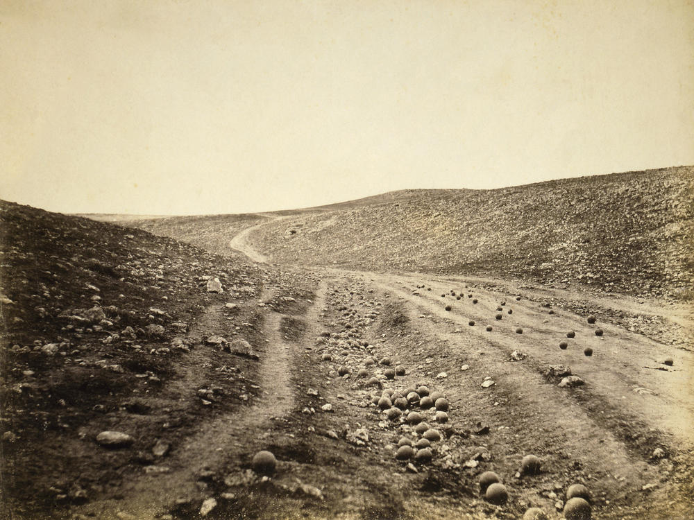 An early and famous war photograph shows unexploded cannonballs after the Charge of the Light Brigade, a failed British military operation in the 1854 Battle of Balaklava during the Crimean War.