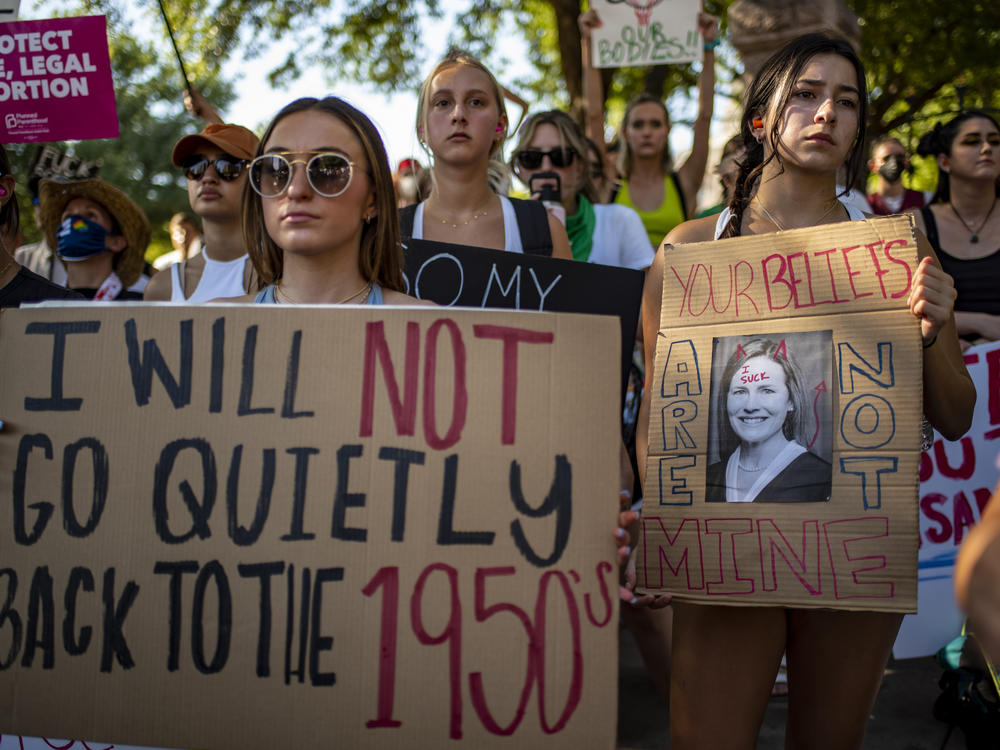 Protesters hold up signs during an abortion-rights rally on Saturday in Austin, Texas.