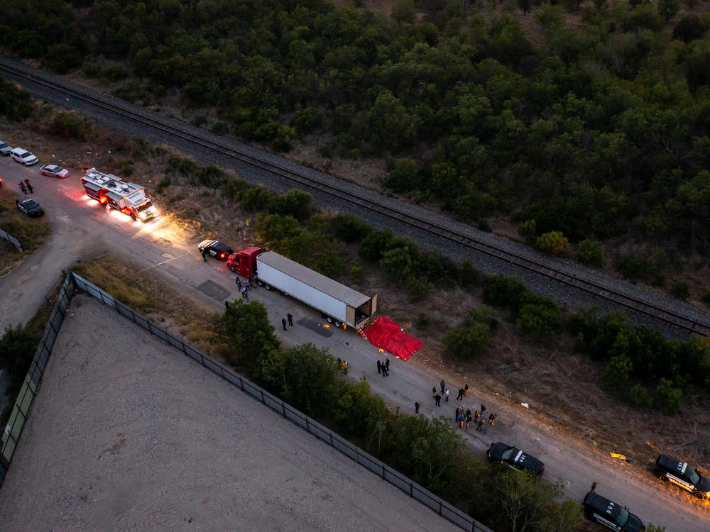 In this aerial view, members of law enforcement investigate a tractor trailer on Monday in San Antonio, Texas.