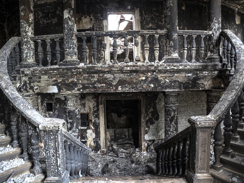 Debris covers the inside of the drama theater in April following a March 16 bombing in Mariupol, Ukraine, in an area now controlled by Russian forces.