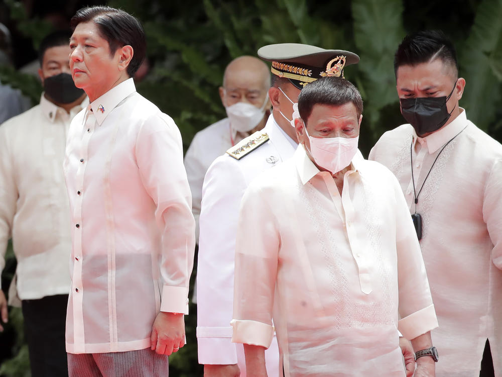 Incoming Philippine president Ferdinand Marcos Jr., left, and outgoing President Rodrigo Duterte, right, attend Marcos' inauguration ceremony in Manila, Philippines, Thursday, June 30, 2022.