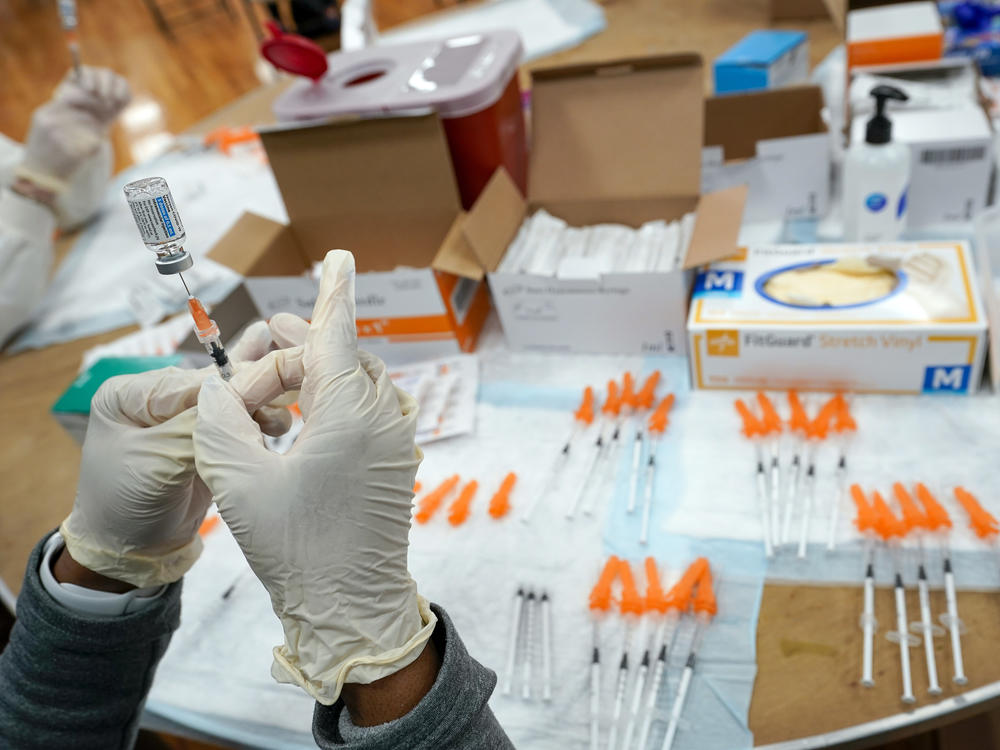 A nurse fills a syringe with a COVID-19 vaccine in the Staten Island borough of New York on April 8, 2021. The Food and Drug Administration on Thursday recommended that COVID booster shots be modified to better match more recent variants of the coronavirus.