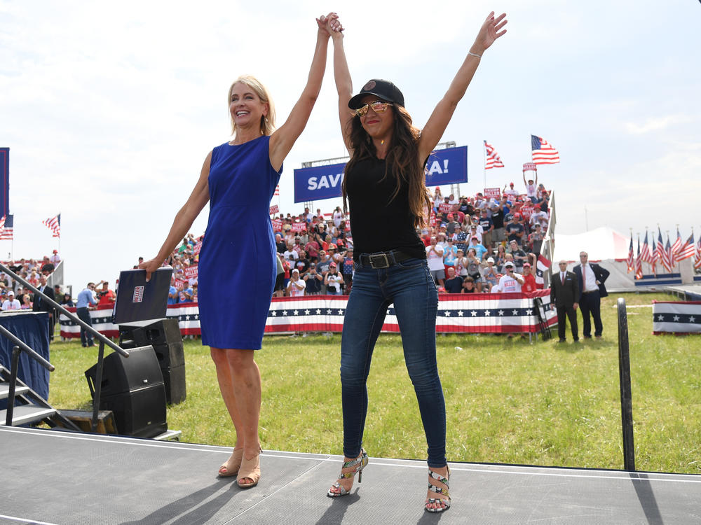 Republican Reps. Mary Miller of Illinois, left, and Lauren Boebert of Colorado appear at a Save America rally with former President Donald Trump at the Adams County Fairgrounds on June 25, 2022, in Mendon, Ill.