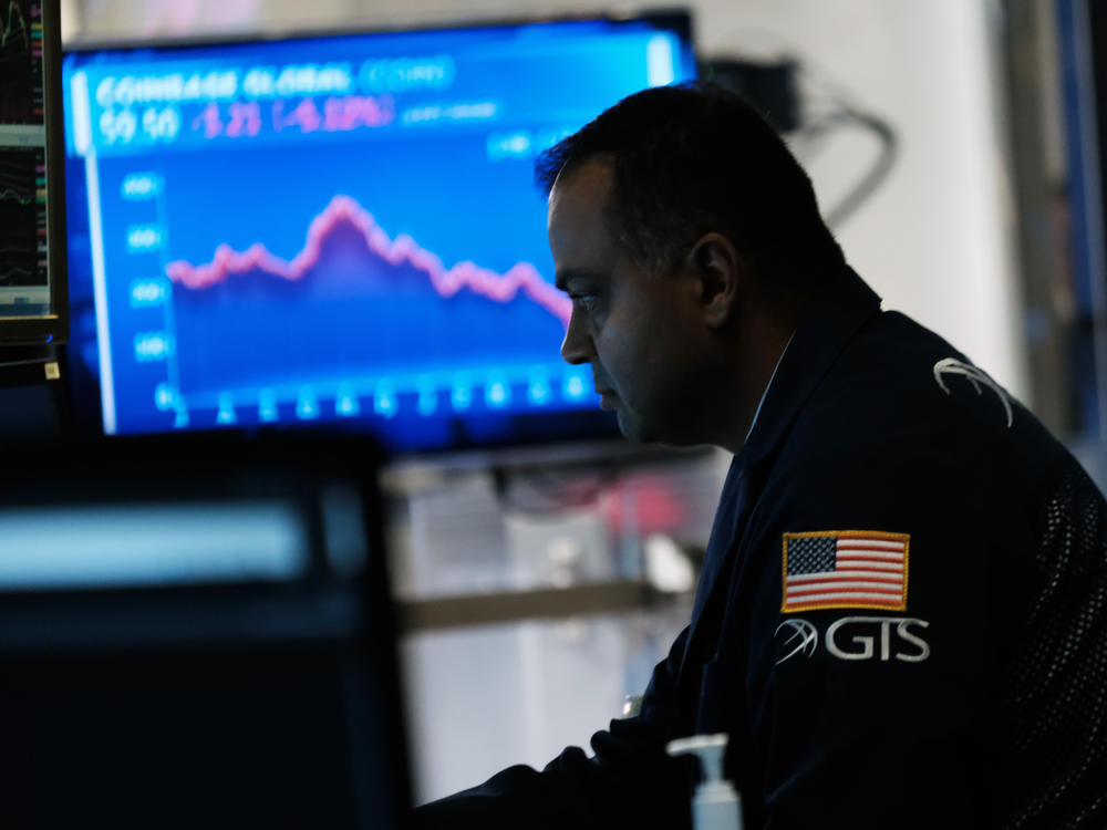 Traders work on the floor of the New York Stock Exchange.