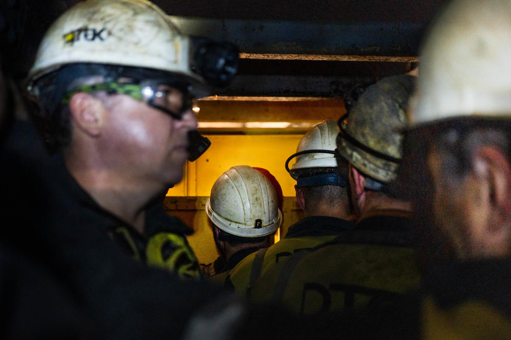 Workers wait to get off an elevator at a coal mine in eastern Ukraine.