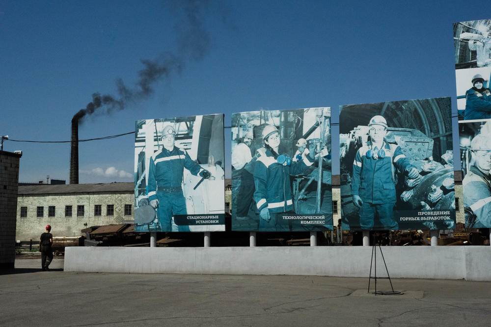 Signs of workers rise above the grounds of a coal mine in eastern Ukraine.