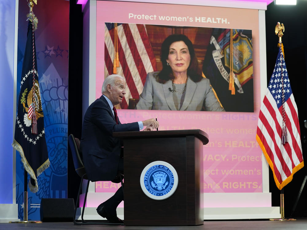 President Joe Biden speaks as New York Gov. Kathy Hochul appears on a screen during a virtual meeting with Democratic governors on abortion rights on Friday.