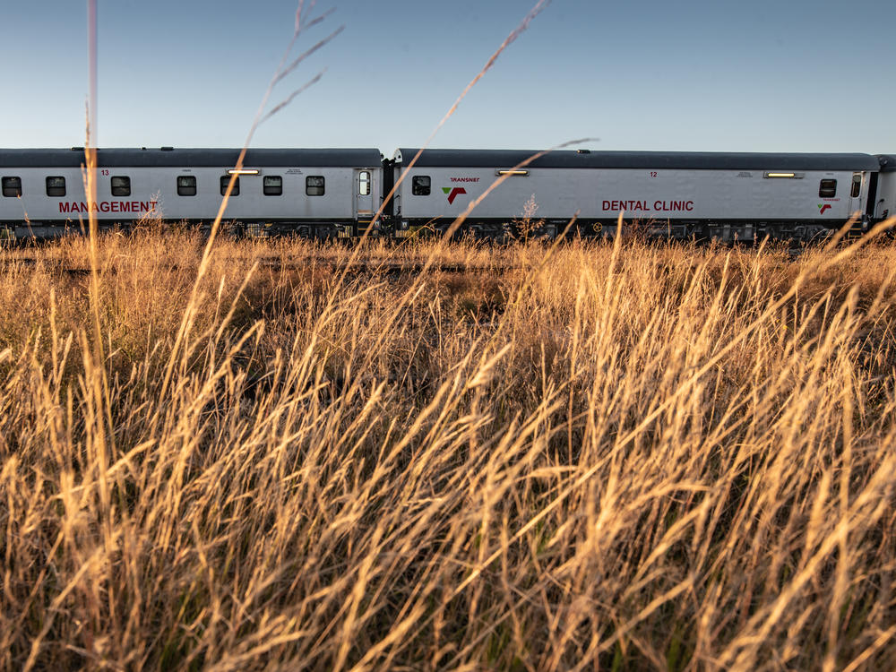 The Phelophepa health-care train on the outskirts of Thaba Nchu, South Africa. To alert patients that the train is coming, Transnet, the company that runs the Phelophepa, publishes a schedule for the year. And community mobilizers in each town make sure patients are aware of the train's arrival.