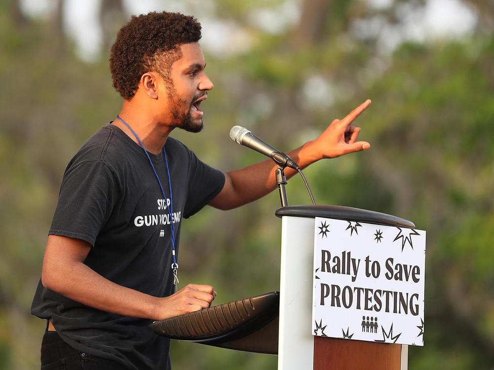 Maxwell Frost, then the National Organizing Director for March For Our Lives, speaks during a March For Our Lives Florida drive-in rally and aid event.