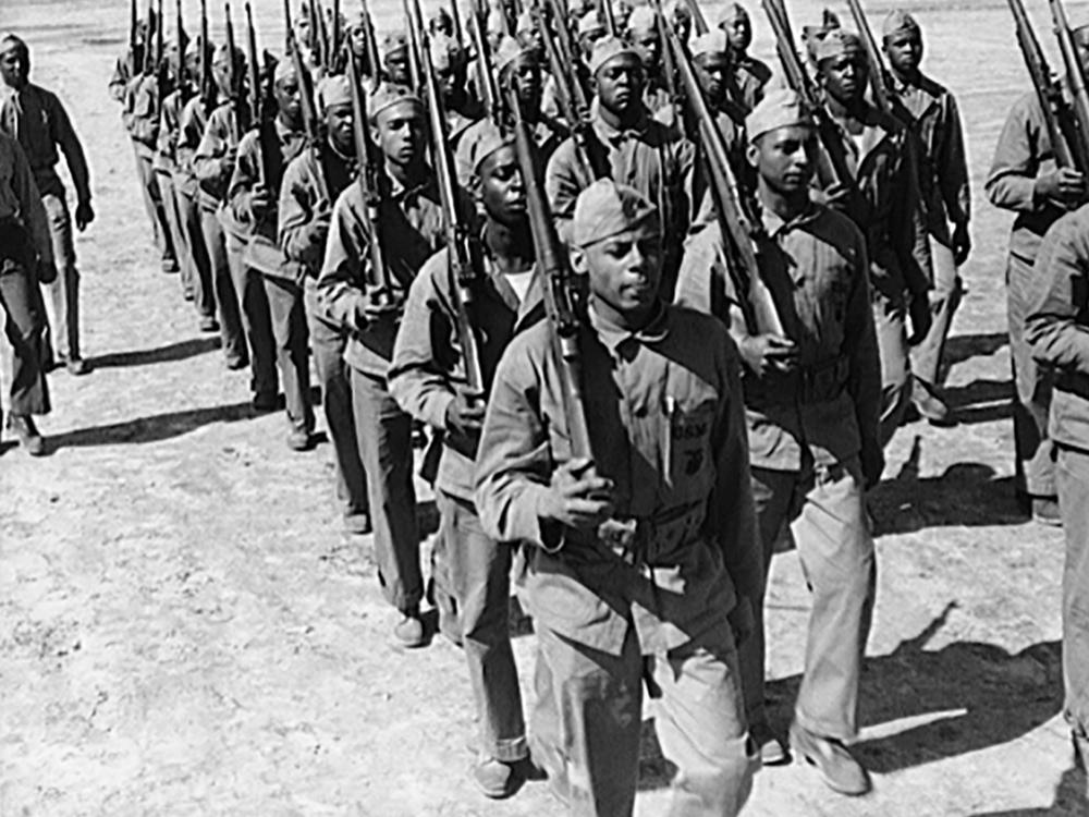 New recruits learn to drill. Breaking a tradition of 167 years, the U.S. Marine Corps enlisted blacks, June 1, 1942. The first class of 1,200 black volunteers began their training three months later as members of the 51st Composite Defense Battalion.