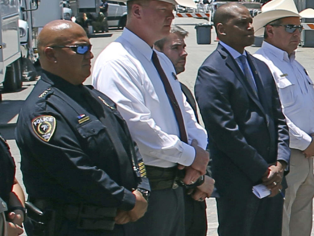 Uvalde School Police Chief Pete Arredondo (left) attends a news conference outside of the Robb Elementary School in Uvalde, Texas, on May 26.